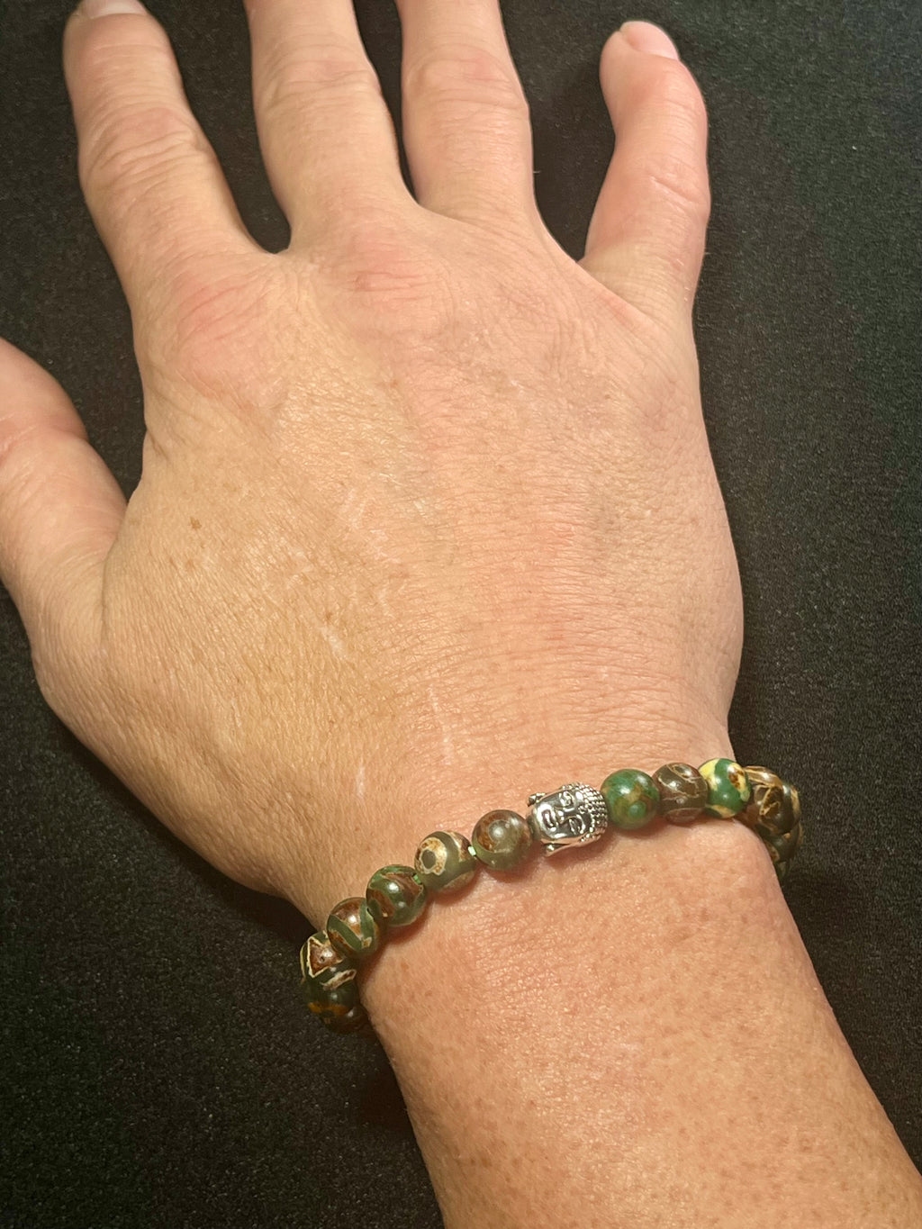 Tibetan Green Eye Agate (dzi) Matte smooth round 8mm bead stretch bracelet w/ silver Buddha accent bead.