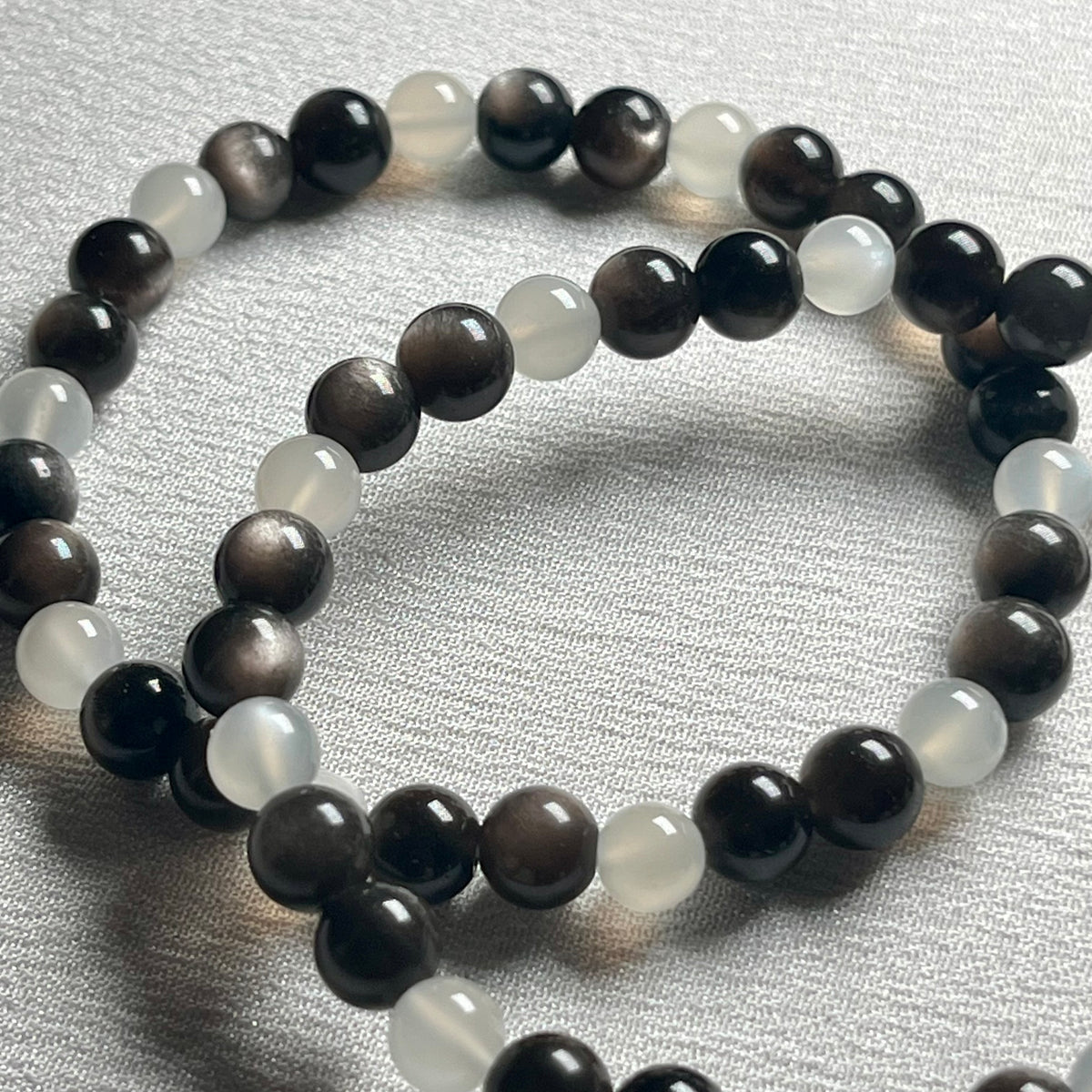 High-quality Silver Sheen Obsidian & White Moonstone smooth round 6mm bead stretch bracelet