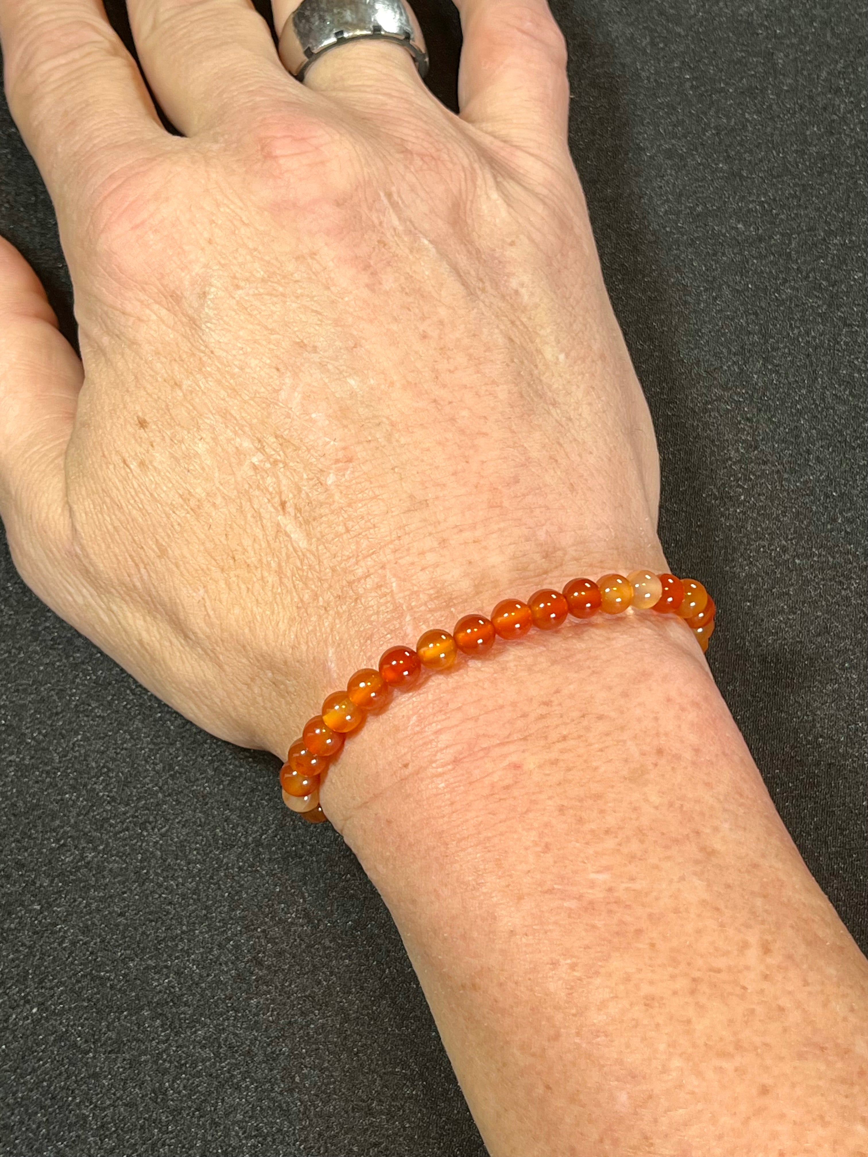 Carnelian (natural orange) smooth round 6mm bead stretch bracelet; July birthstone