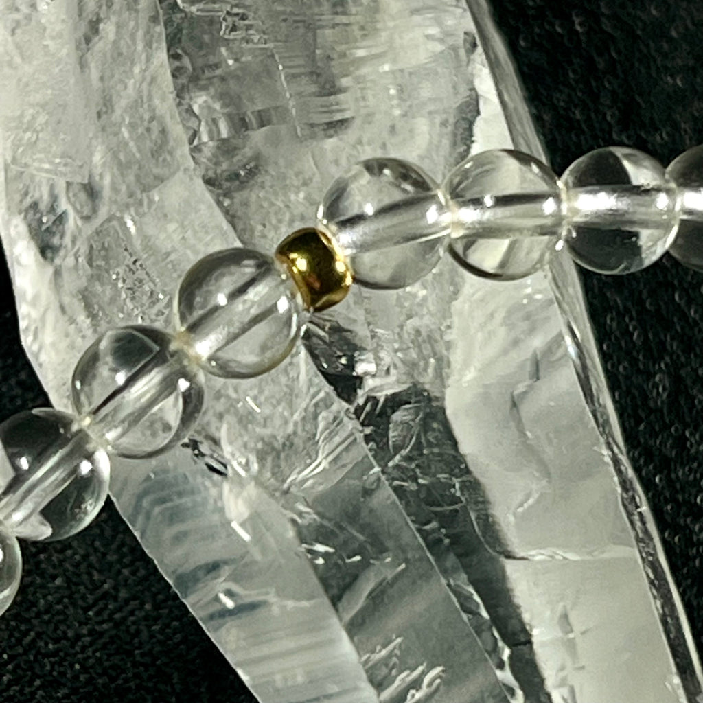 Clear Quartz smooth round 4mm single stretch bracelet w/ Clear Quartz cross charm gold finish & 24k gold spacer