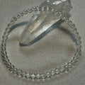Clear Crystal Quartz smooth round 4mm, 6mm bead stretch bracelet (premium); April birthstone
