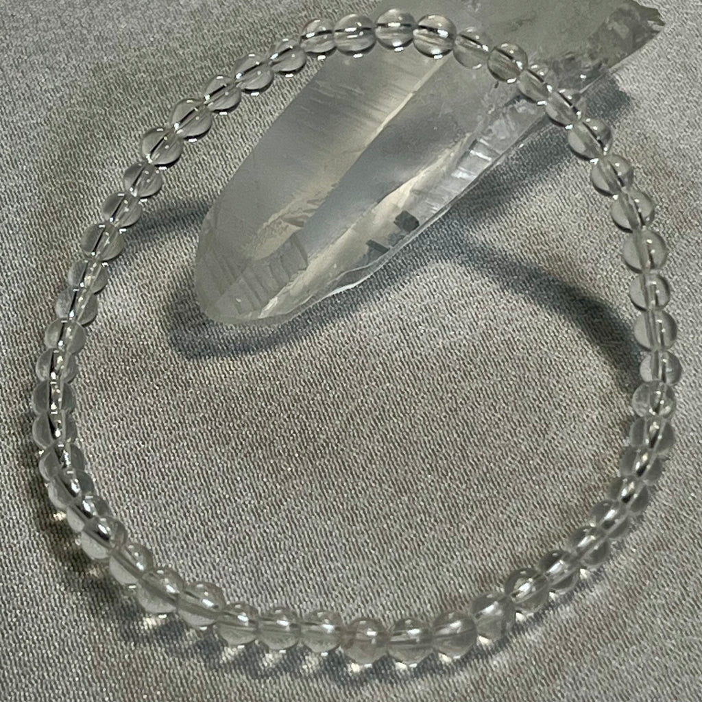 Clear Crystal Quartz smooth round 4mm, 6mm bead stretch bracelet (premium); April birthstone