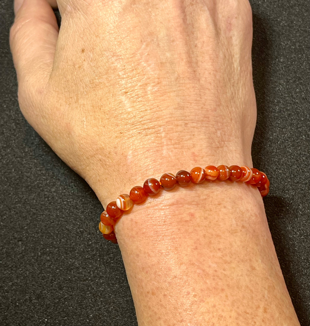 Carnelian (dark orange) smooth round 6mm bead stretch bracelet; July birthstone