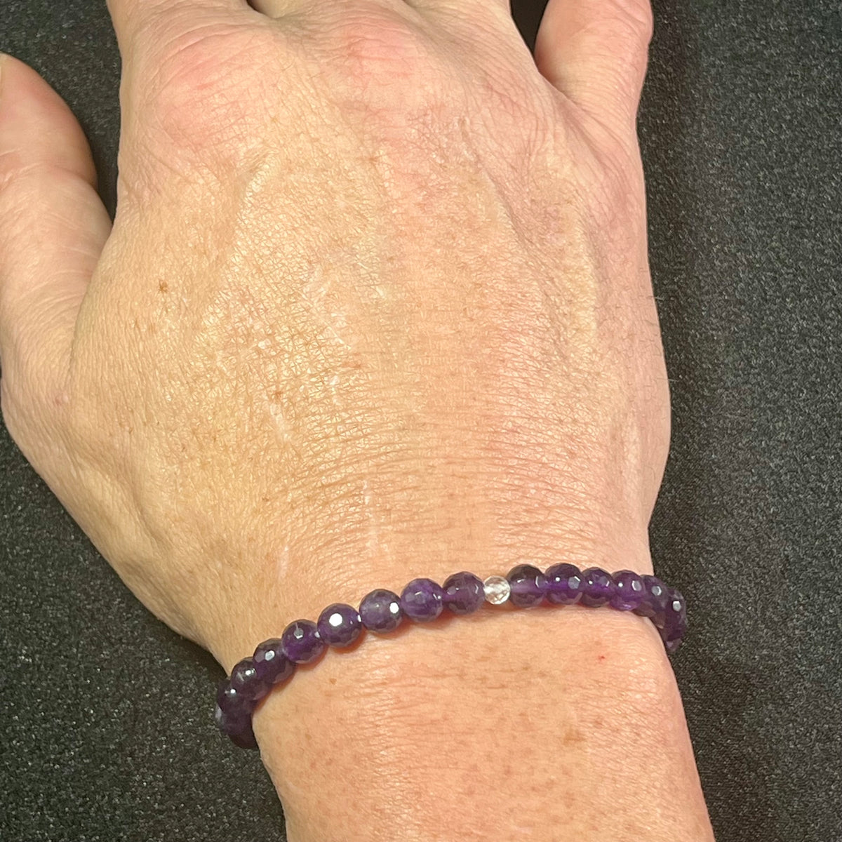 Amethyst (dark) faceted round 6mm bead stretch bracelet w/4mm microfaceted Clear Quartz spacer