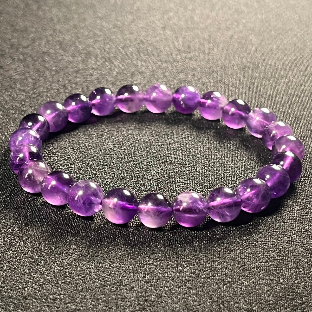 Amethyst smooth round 8mm bead stretch bracelet; February birthstone