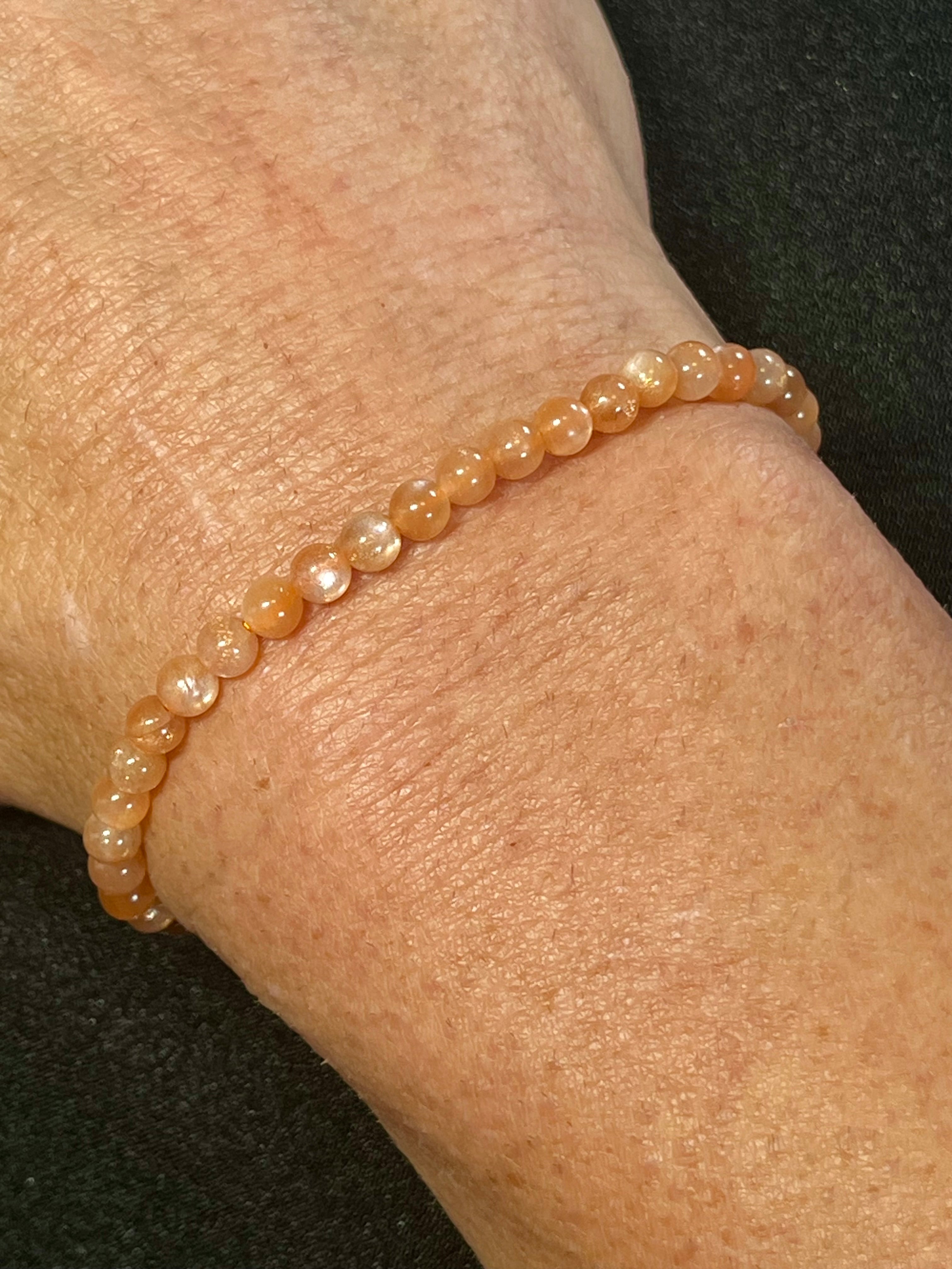 Sunstone w/ strong Moonstone-like adularescence smooth round 4mm bead stretch bracelets (premium grade)