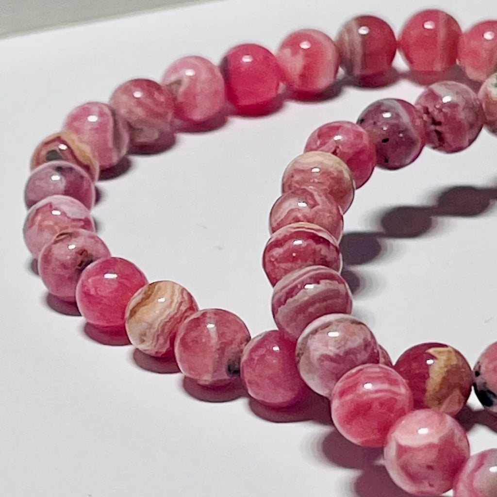 Argentina Rhodochrosite smooth round 6mm bead stretch bracelet