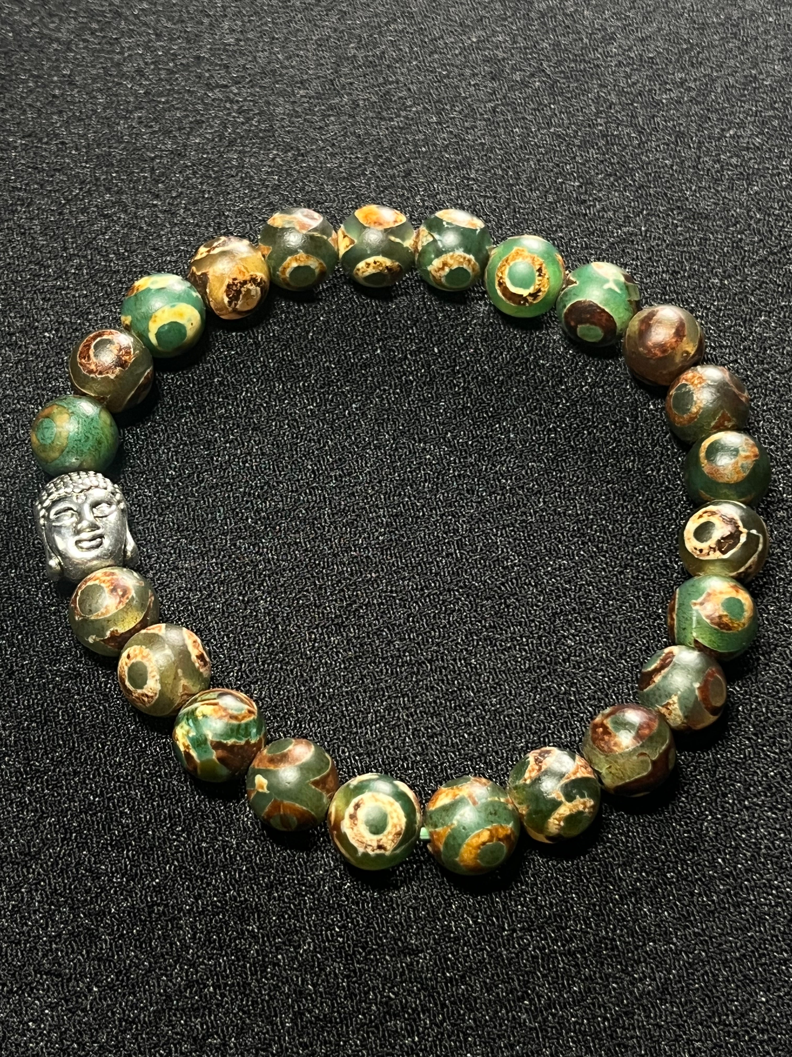 Tibetan Green Eye Agate (dzi) Matte smooth round 8mm bead stretch bracelet w/ silver Buddha accent bead.