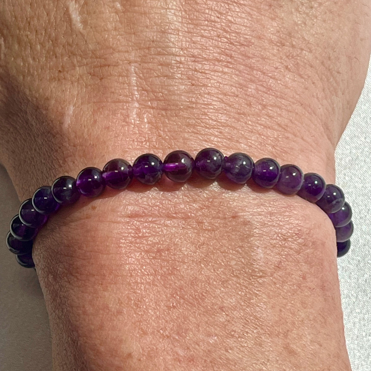 Amethyst (dark) smooth round 6mm, 8mm bead stretch bracelet; February birthstone