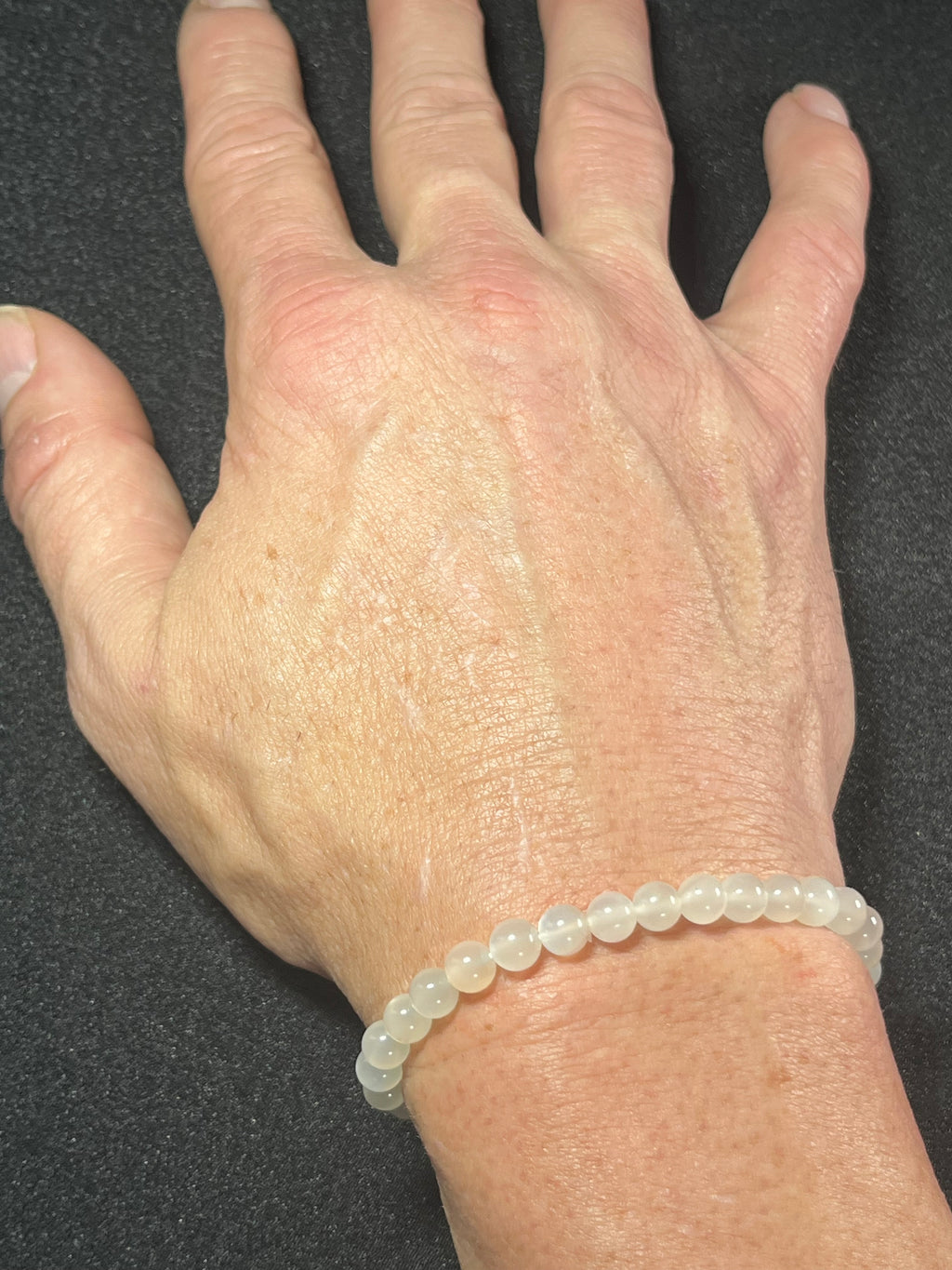 White Moonstone silver flash smooth round 6mm bead stretch bracelet (AA grade); alternative June birthstone