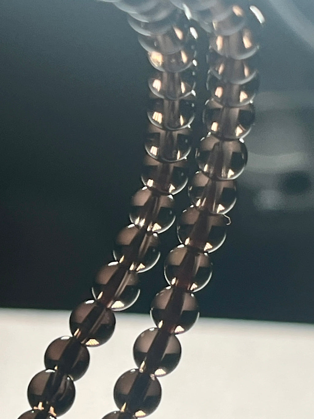 Smoky Quartz smooth round 4mm bead stretch bracelet (premium grade)
