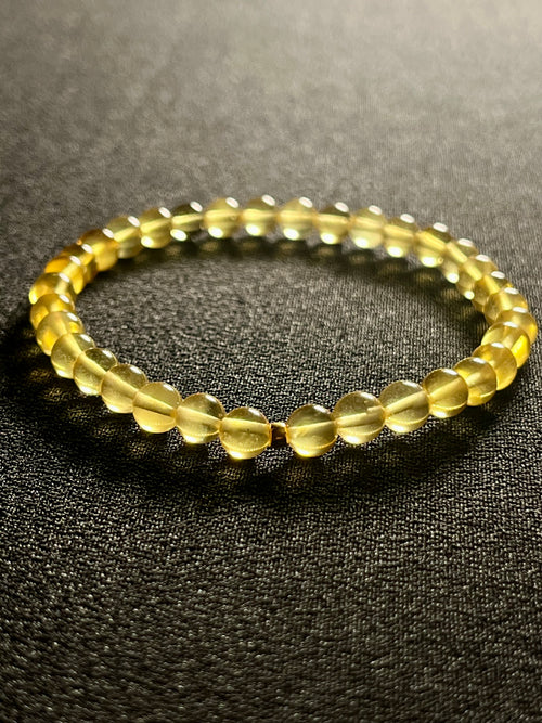 Amber (Light Yellow) w/ 24k gold spacer smooth round 5.5mm bead stretch bracelet