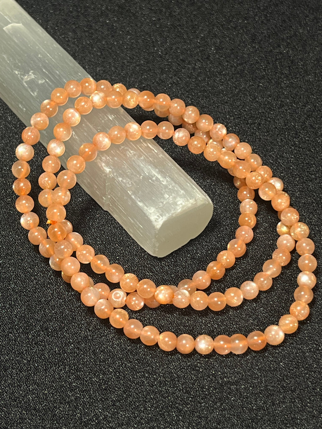 Sunstone w/ strong Moonstone-like adularescence smooth round 4mm bead stretch bracelets (premium grade)