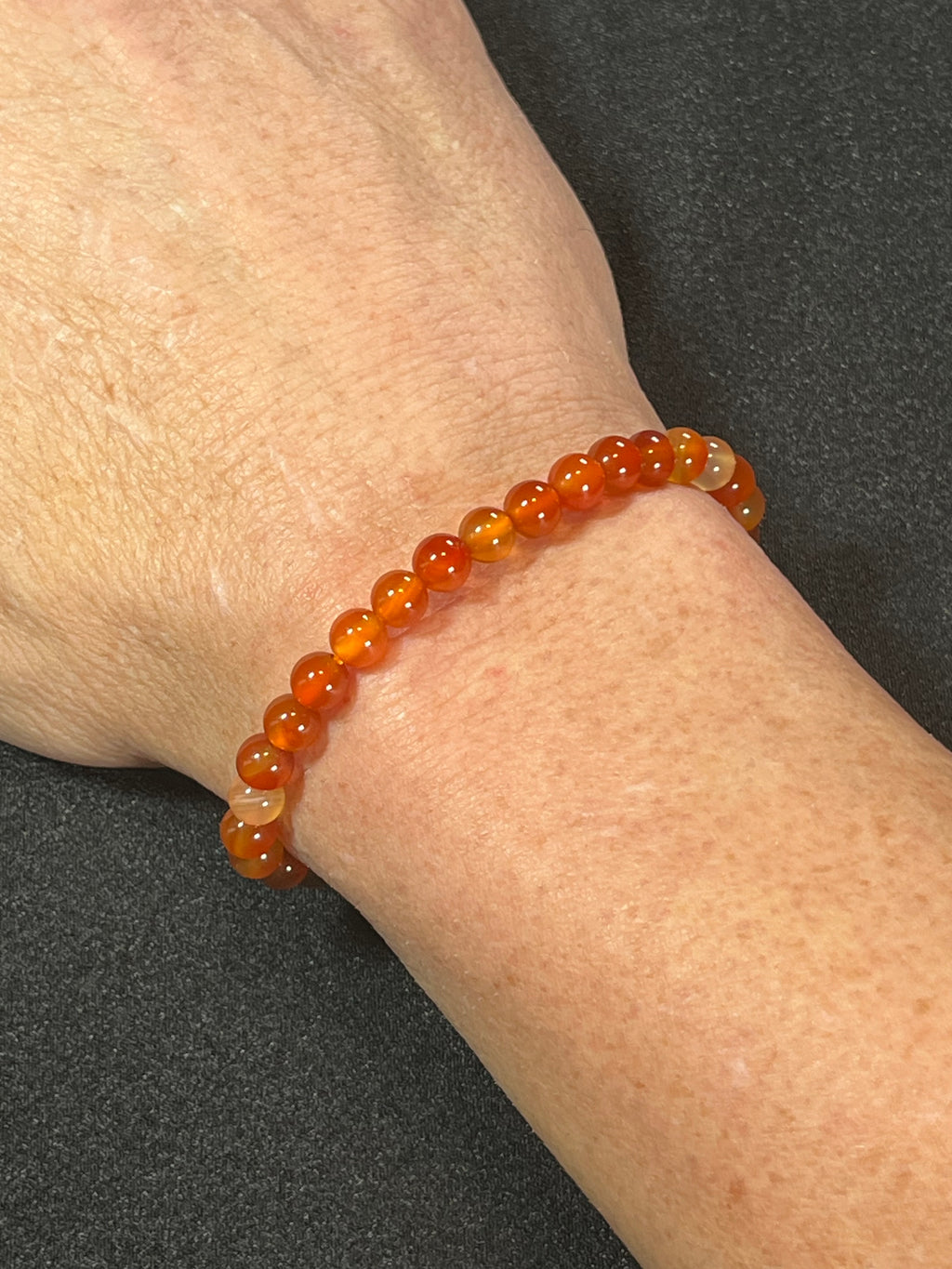 Carnelian (natural orange) smooth round 6mm bead stretch bracelet; July birthstone