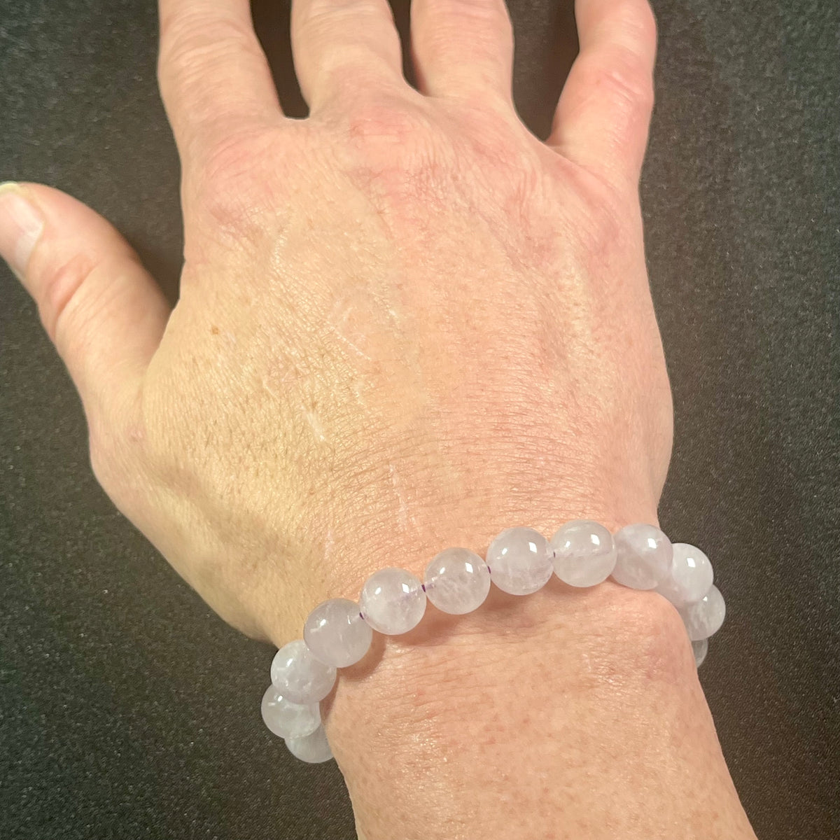 Lavender Amethyst smooth round 10mm bead single stretch bracelet; February birthstone