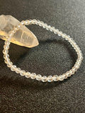 Clear Crystal Quartz faceted round 4mm bead stretch bracelet (premium)
