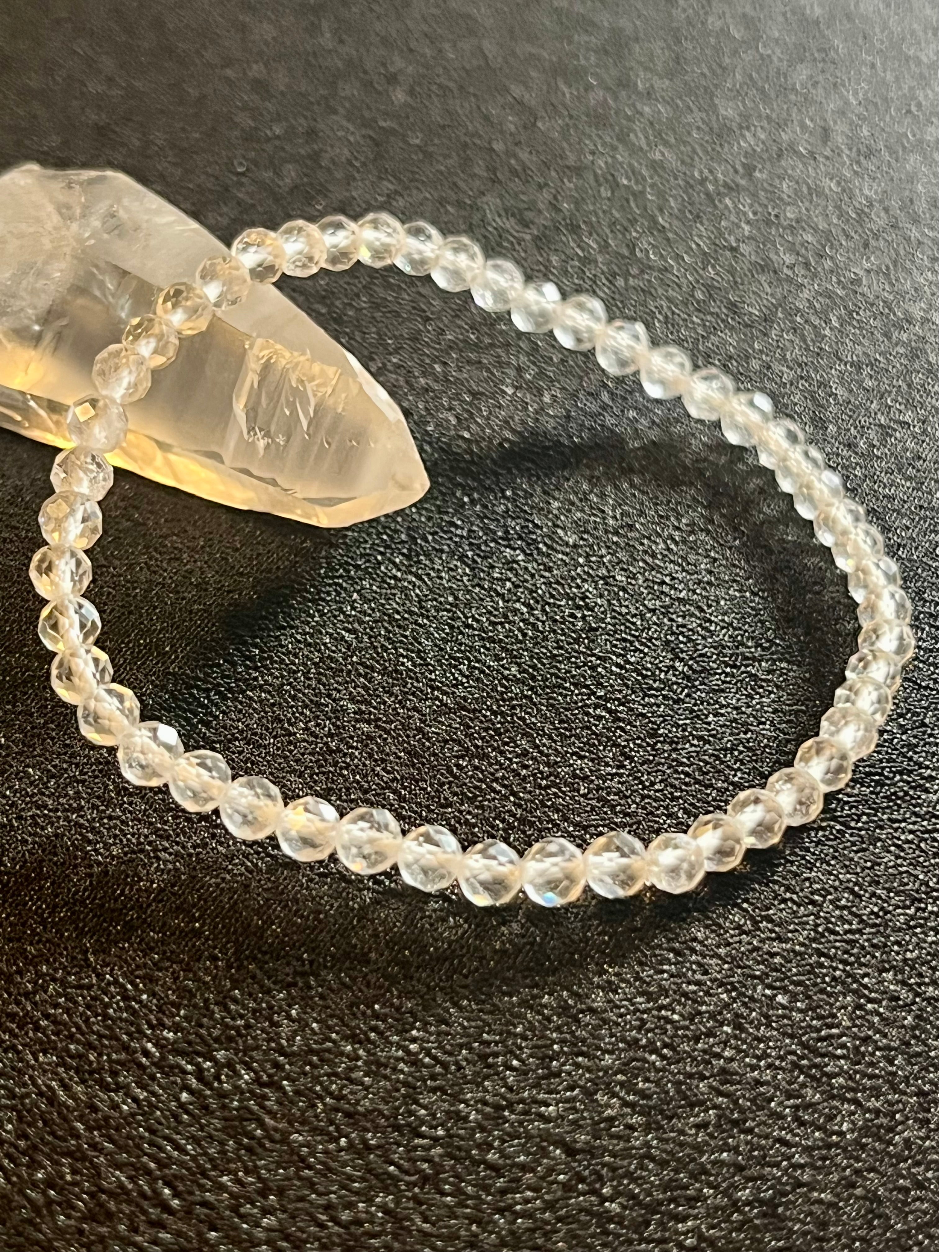 Clear Crystal Quartz faceted round 4mm bead stretch bracelet (premium)