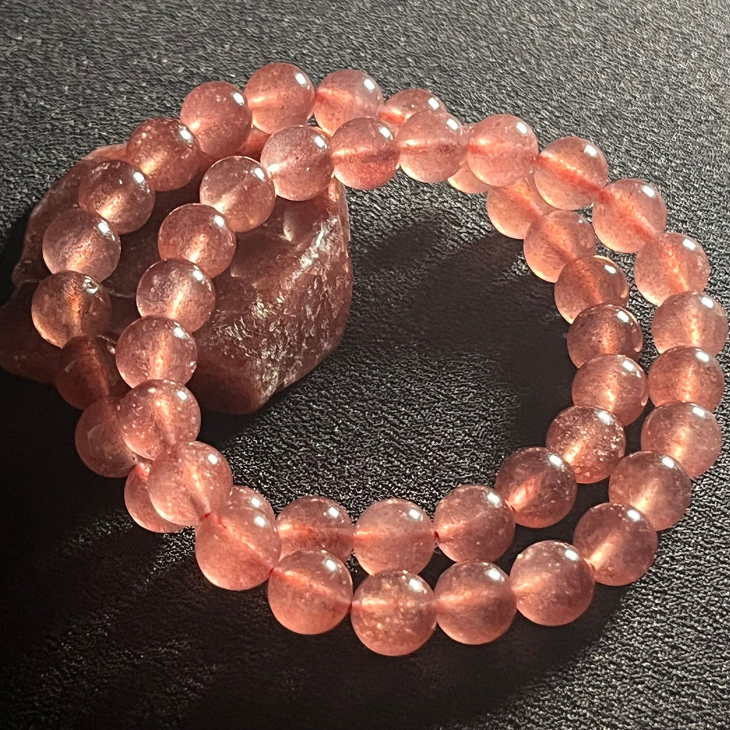 Strawberry Quartz w/ Sparkling Golden Sunstone inclusions smooth round 8mm bead stretch bracelet (AAA grade)