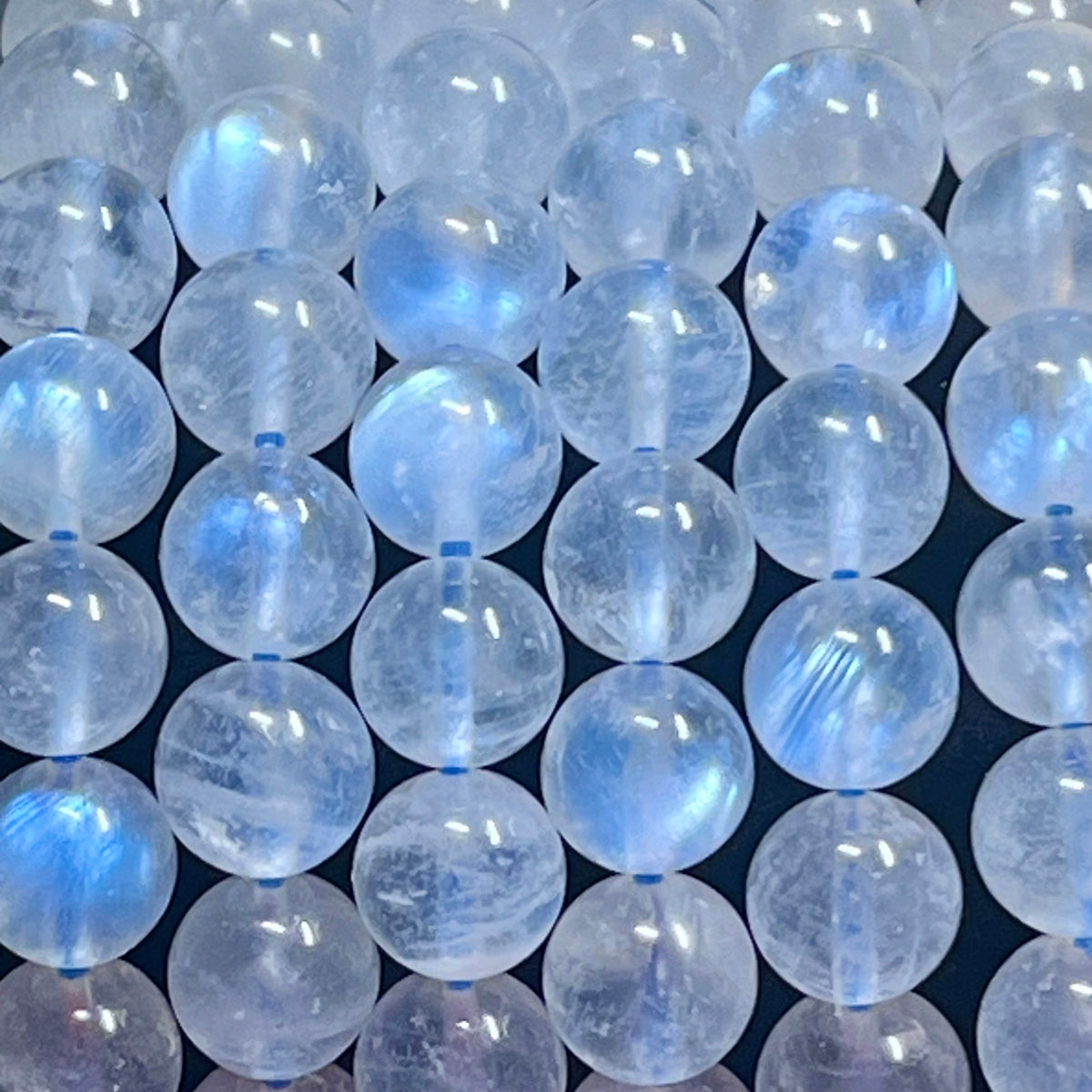 Blue Moonstone smooth round 8mm high-clarity blue flash bead stretch bracelet; June birthstone