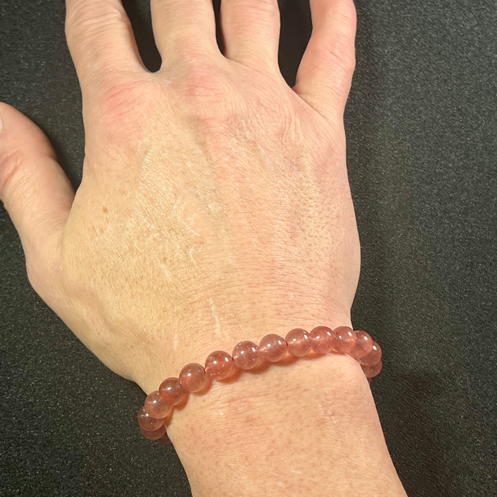 Strawberry Quartz w/ Sparkling Golden Sunstone inclusions smooth round 8mm bead stretch bracelet (AAA grade)