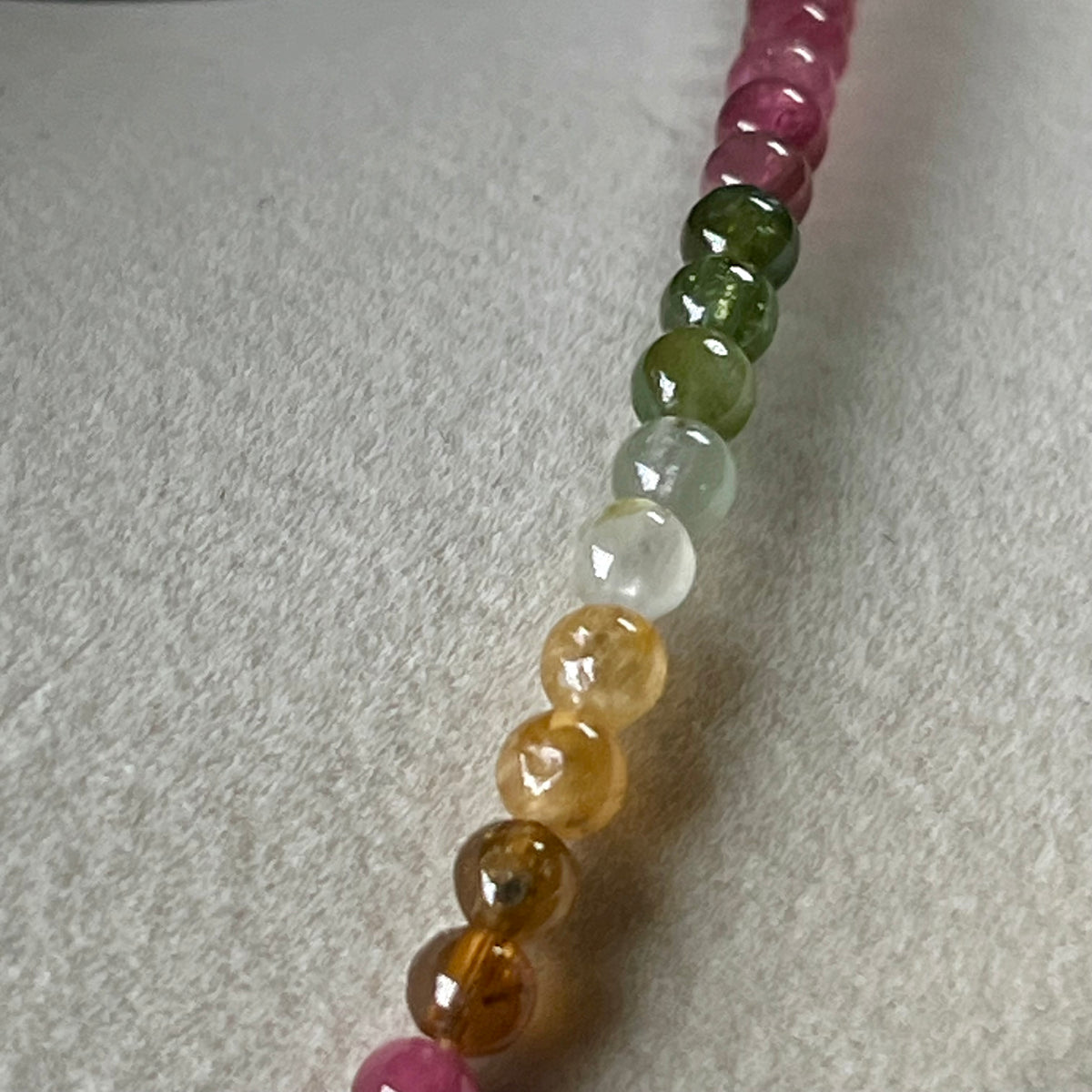 Multi Tourmaline ombre-style smooth round 4mm bead 23” necklace w/ 18k gold clasp & adjustable extension chain (premium grade); October birthstone