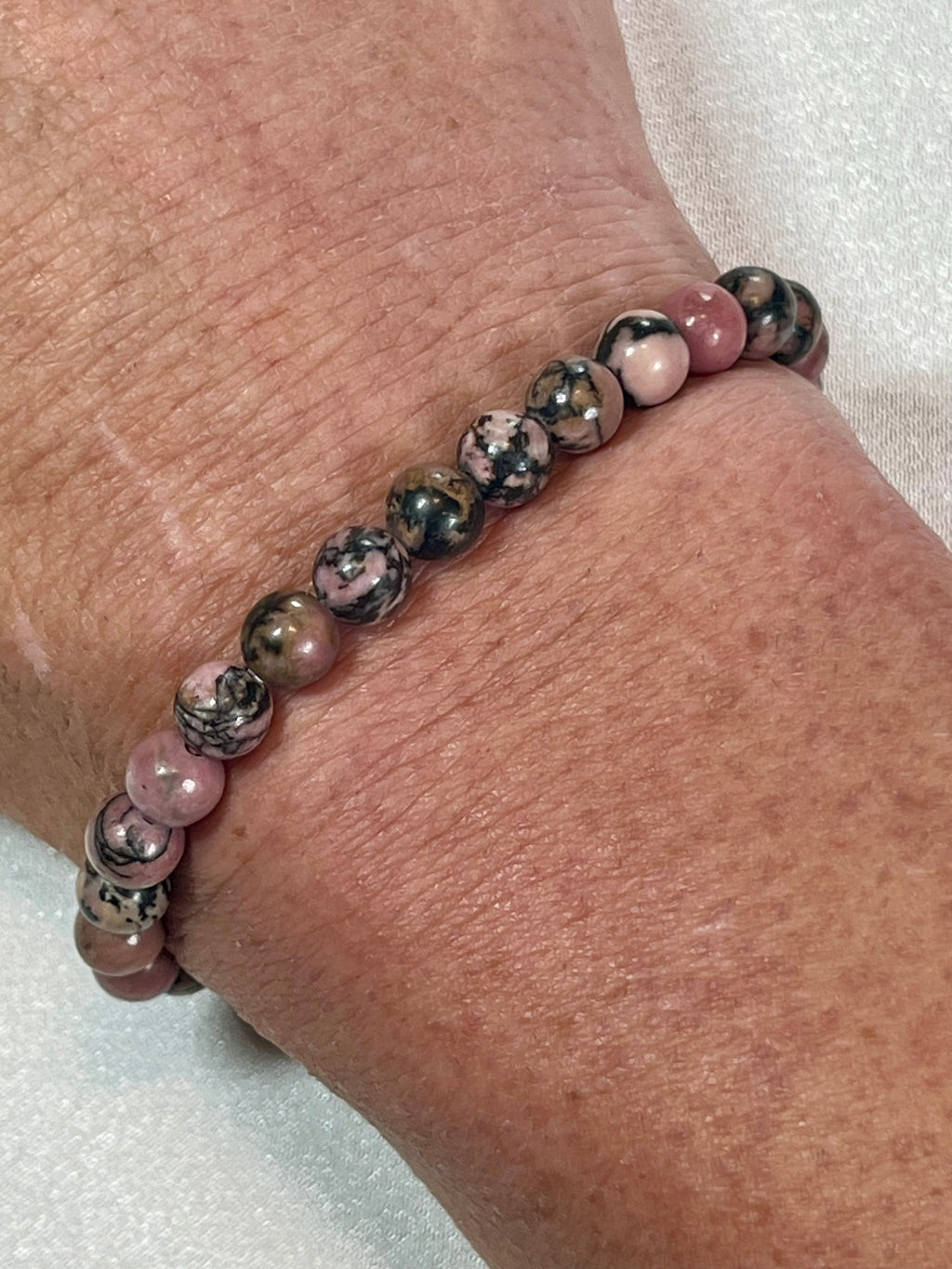 Rhodonite with black matrix smooth round 6mm bead stretch bracelet