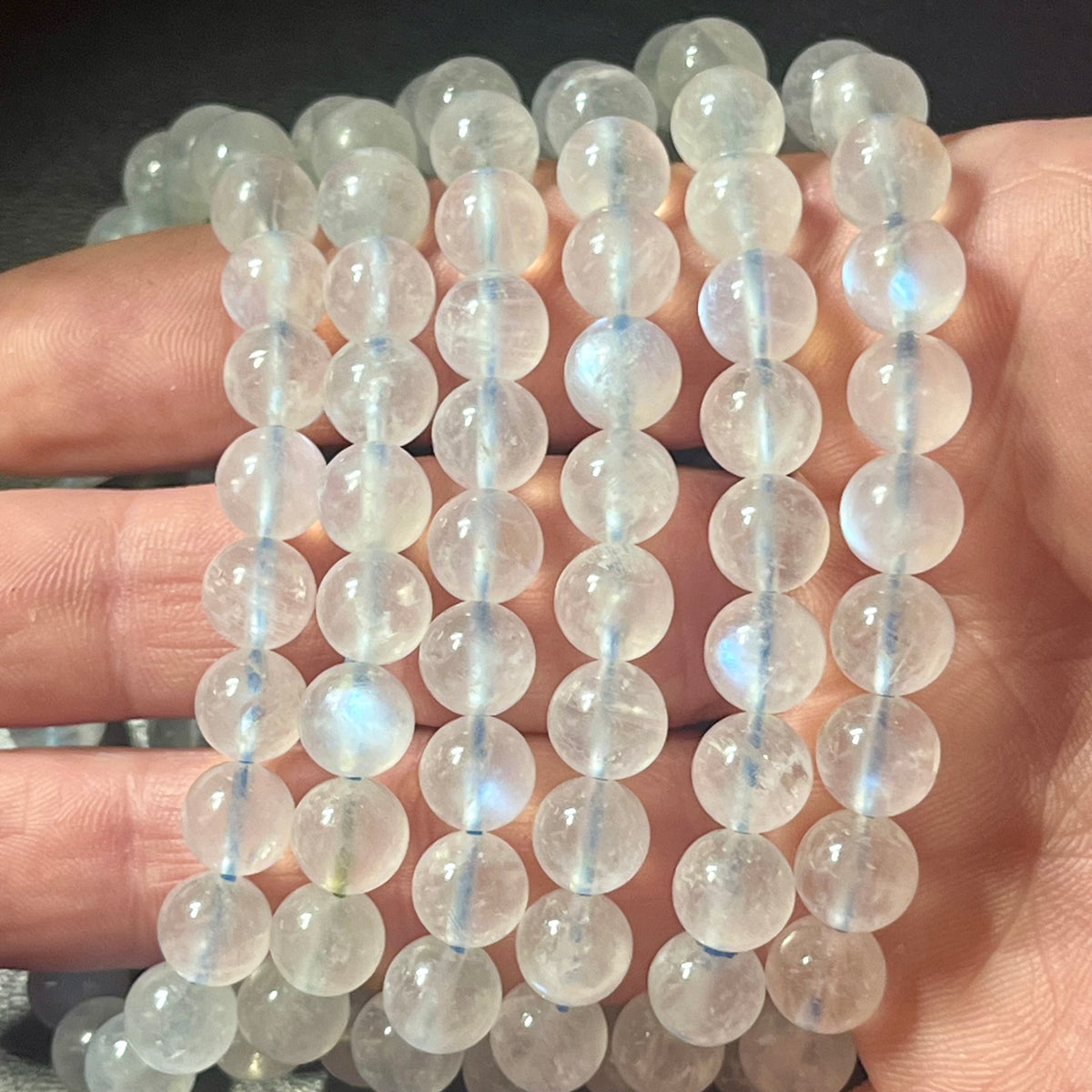 Blue Moonstone smooth round 8mm high-clarity blue flash bead stretch bracelet; June birthstone
