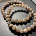 Black Sunstone smooth round 7mm bead stretch bracelet (AA grade)