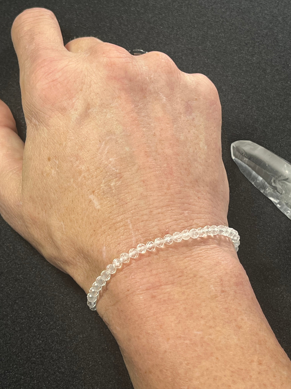 Clear Crystal Quartz faceted round 4mm bead stretch bracelet (premium)