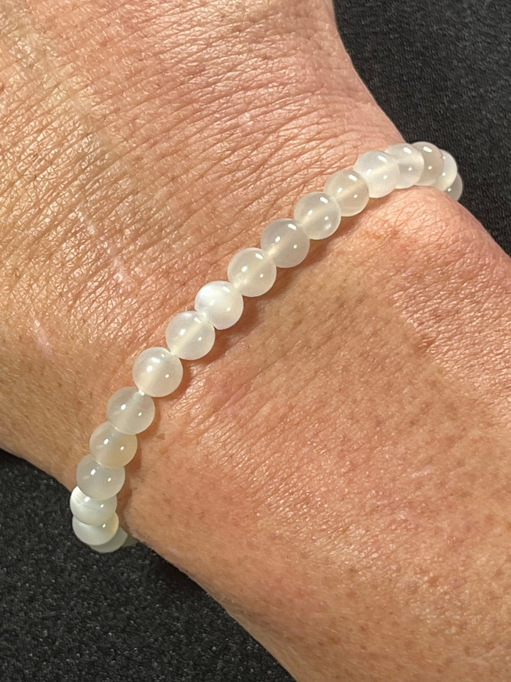White Moonstone silver flash smooth round 6mm bead stretch bracelet (AA grade); alternative June birthstone