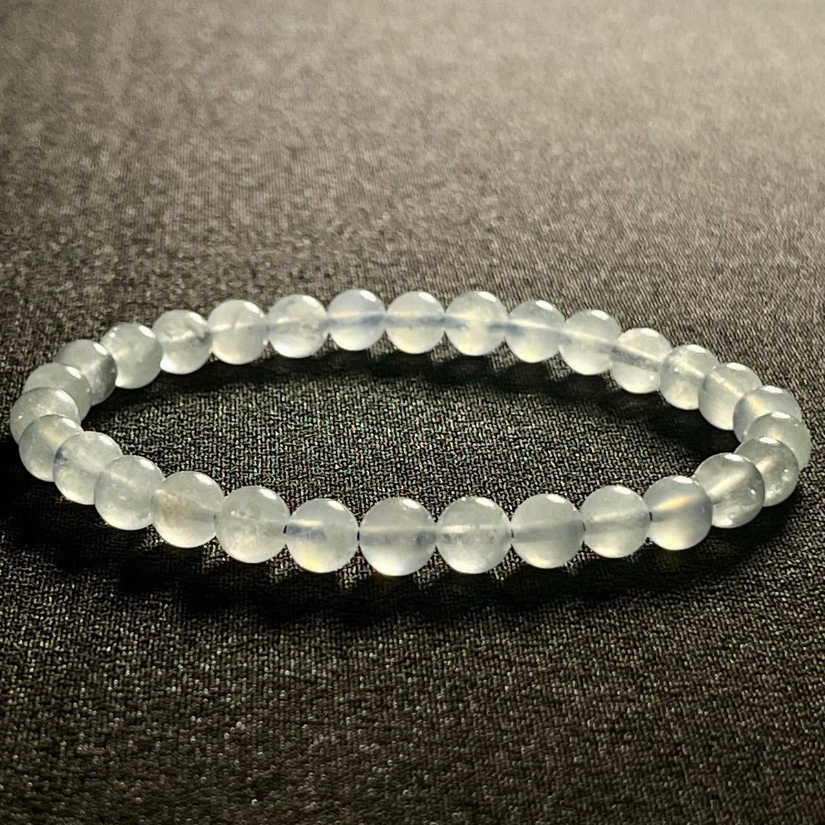 Aquamarine smooth round 6mm bead stretch bracelet; March birthstone