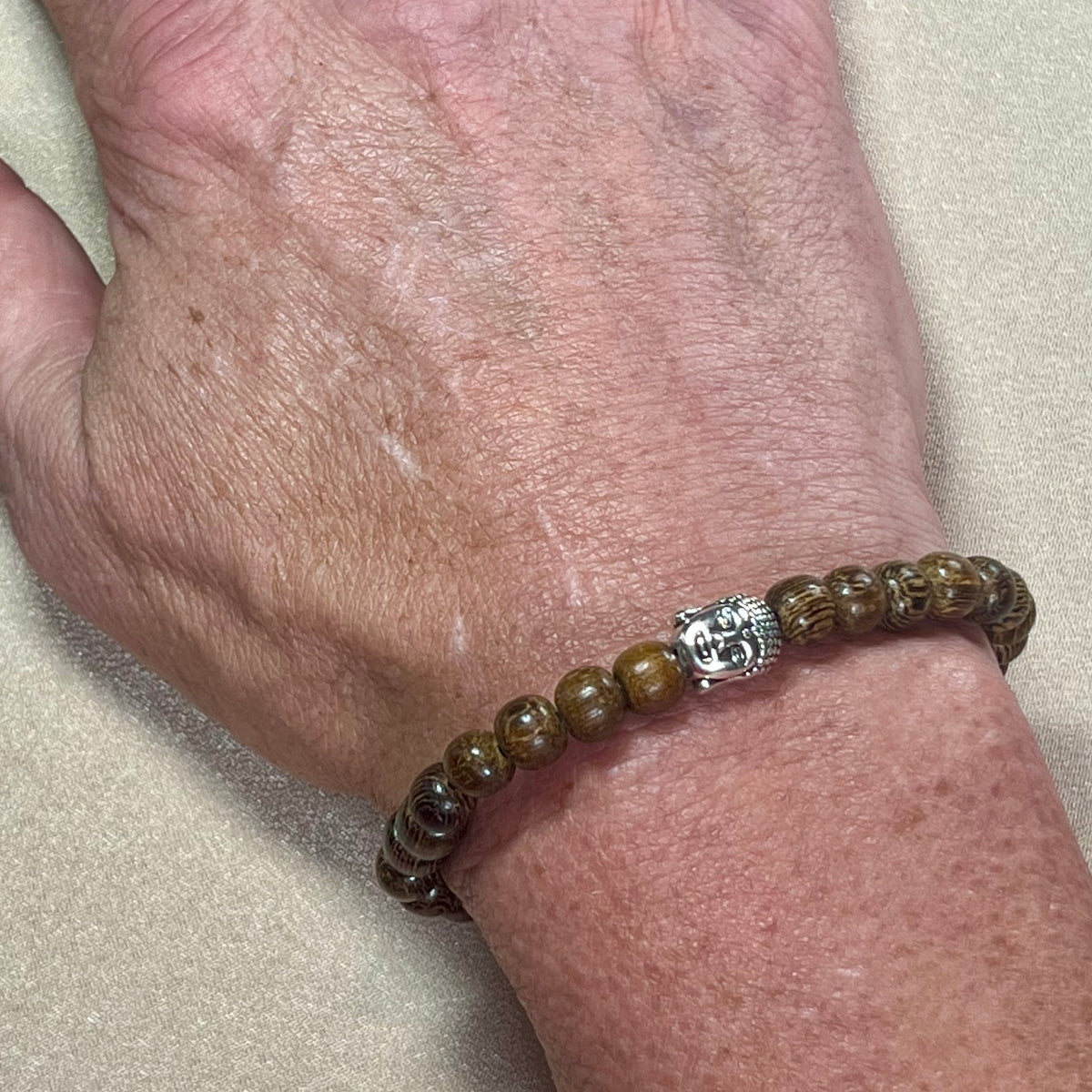 Philippines Robles Wood round 6mm bead stretch bracelet w/ silver Buddha focal