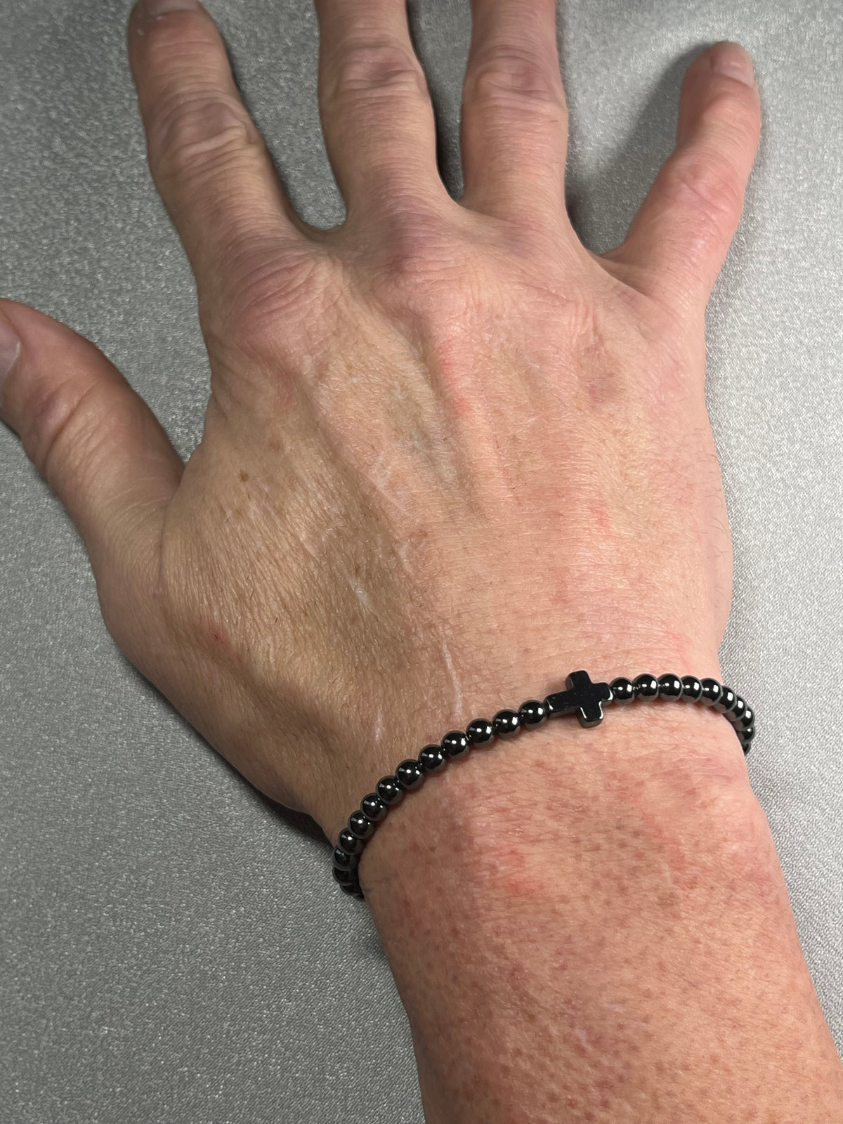 Hematite smooth round 4mm and 6mm bead stretch bracelets w/ Hematite Christian cross focal beads