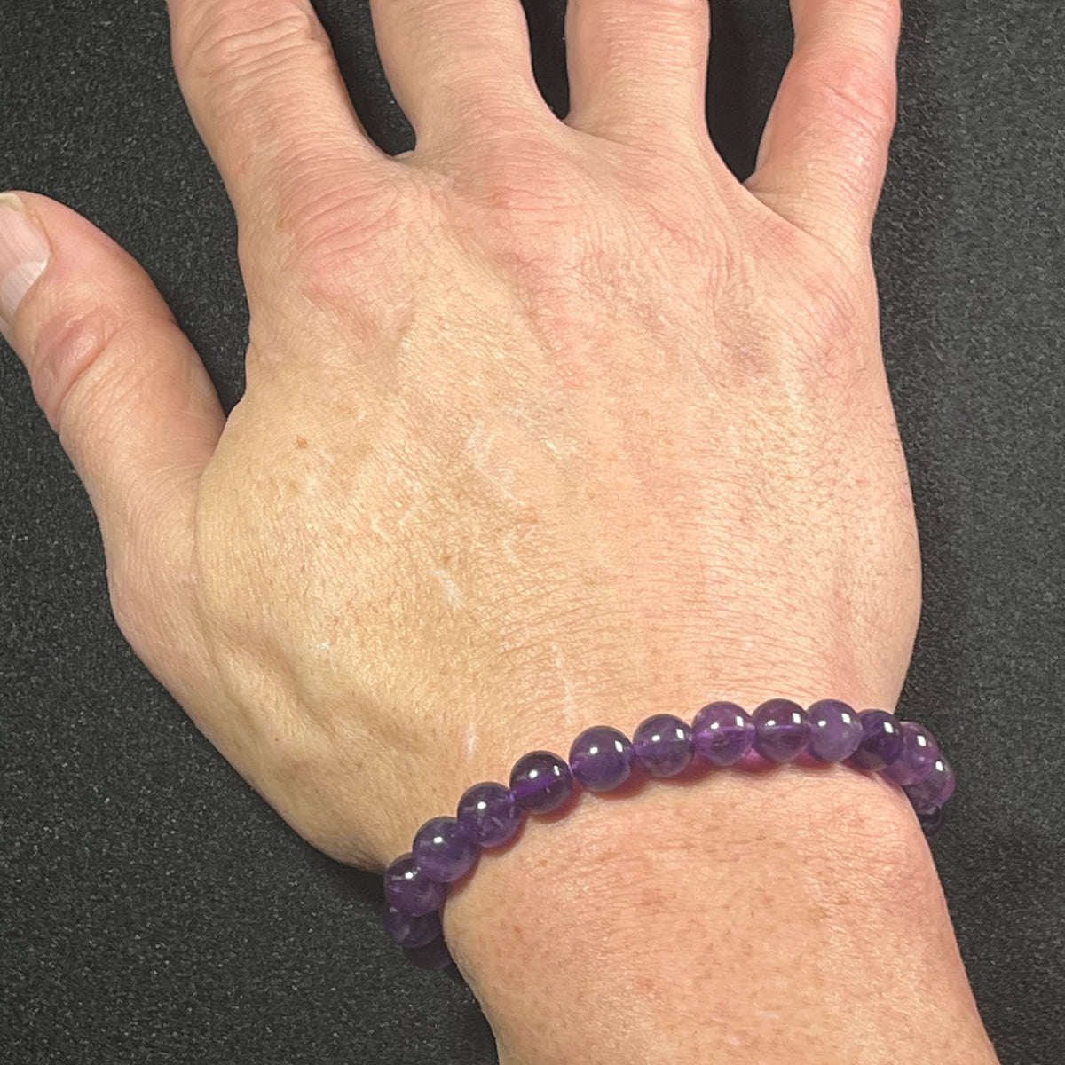 Amethyst smooth round 8mm bead stretch bracelet; February birthstone