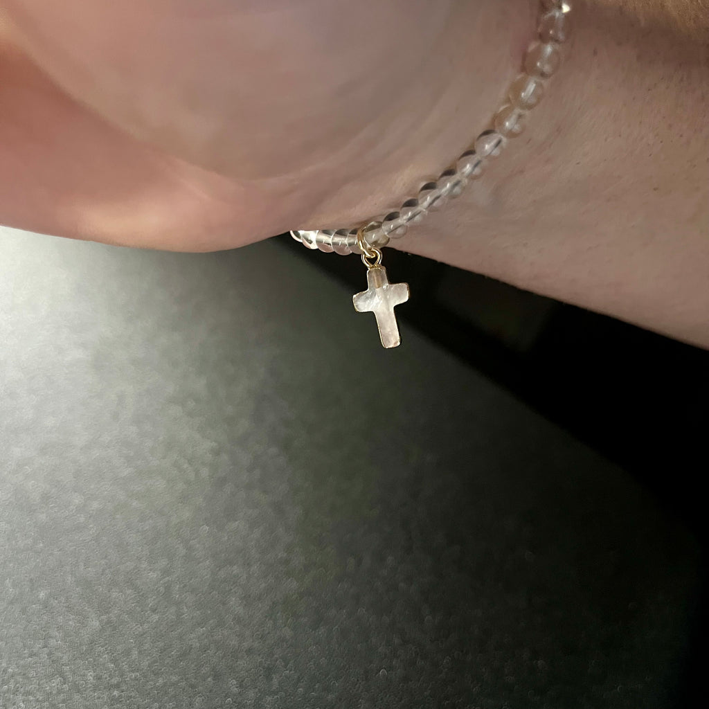 Clear Quartz smooth round 4mm single stretch bracelet w/ Clear Quartz cross charm gold finish & 24k gold spacer