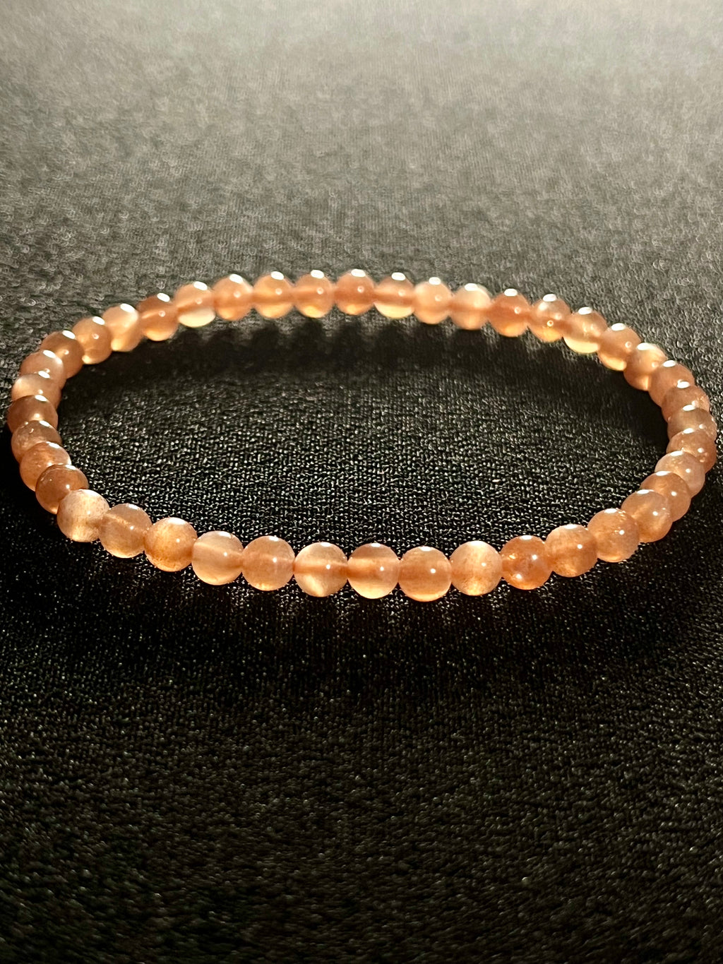 Sunstone w/ strong Moonstone-like adularescence smooth round 4mm bead stretch bracelets (premium grade)