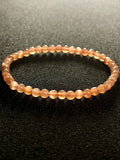 Sunstone w/ strong Moonstone-like adularescence smooth round 4mm bead stretch bracelets (premium grade)