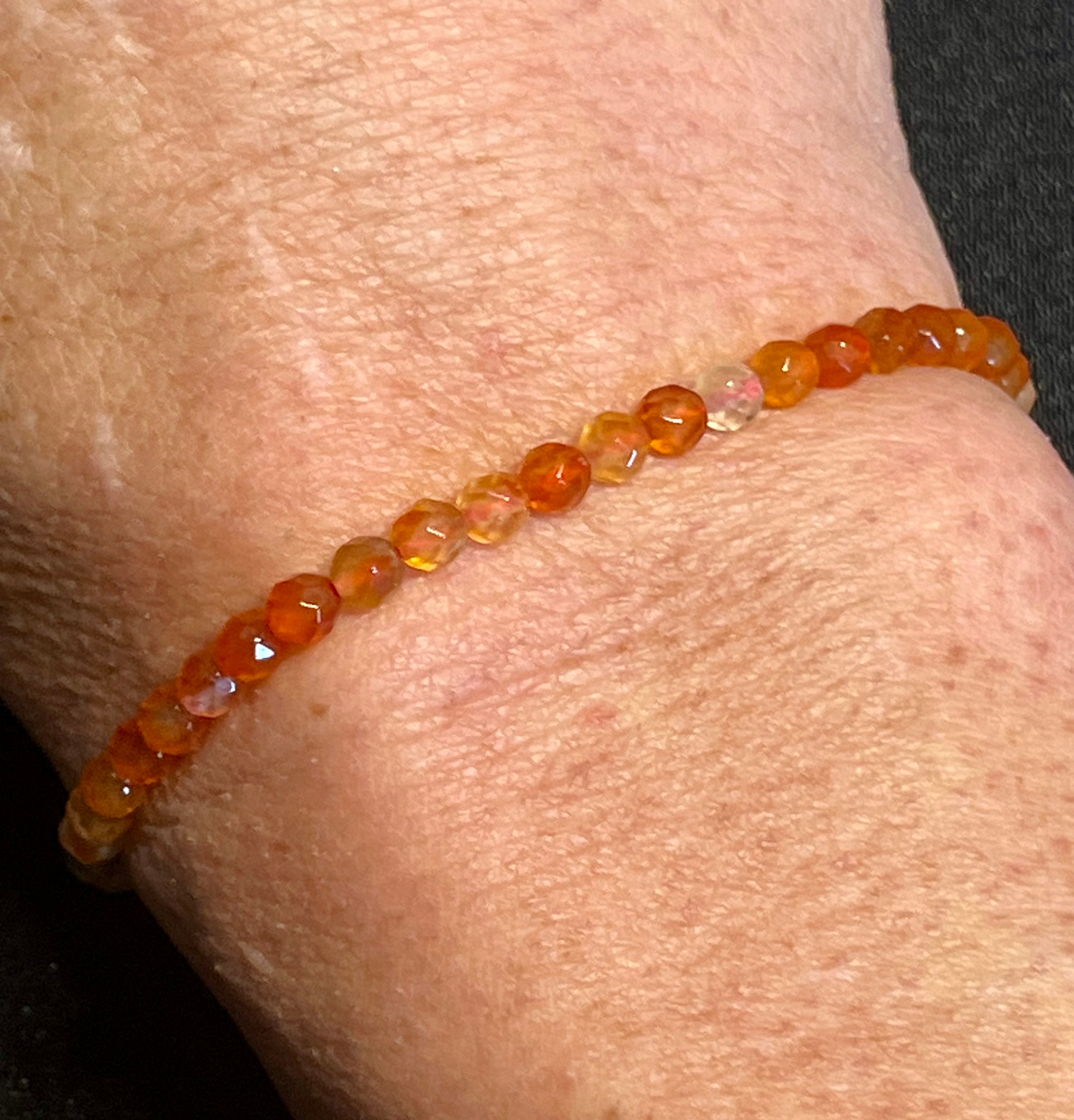 Carnelian (multi-orange) faceted round 4mm bead stretch bracelet; July birthstone