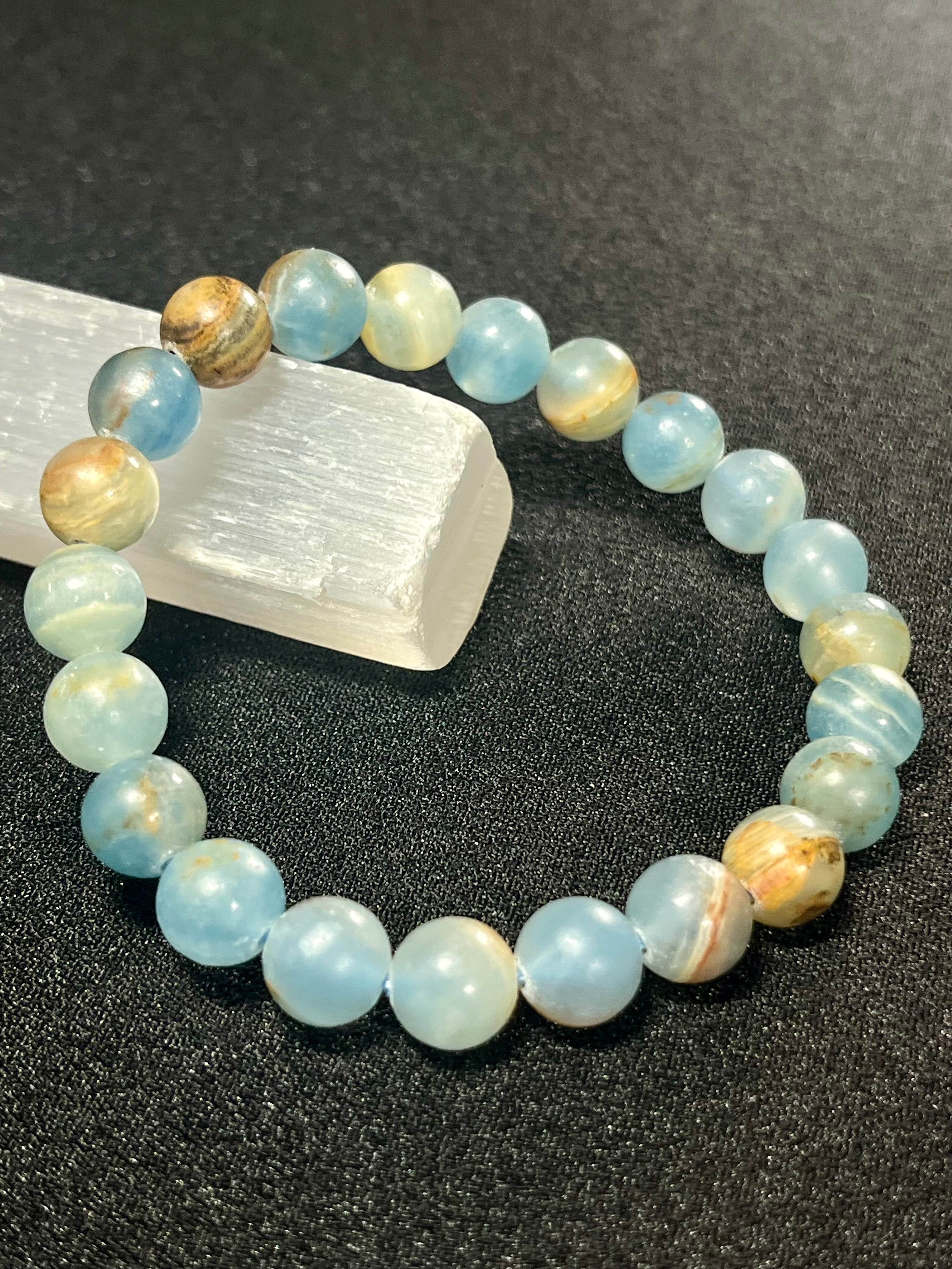 Argentina Blue Calcite smooth round 8mm bead stretch bracelet (AAA grade)