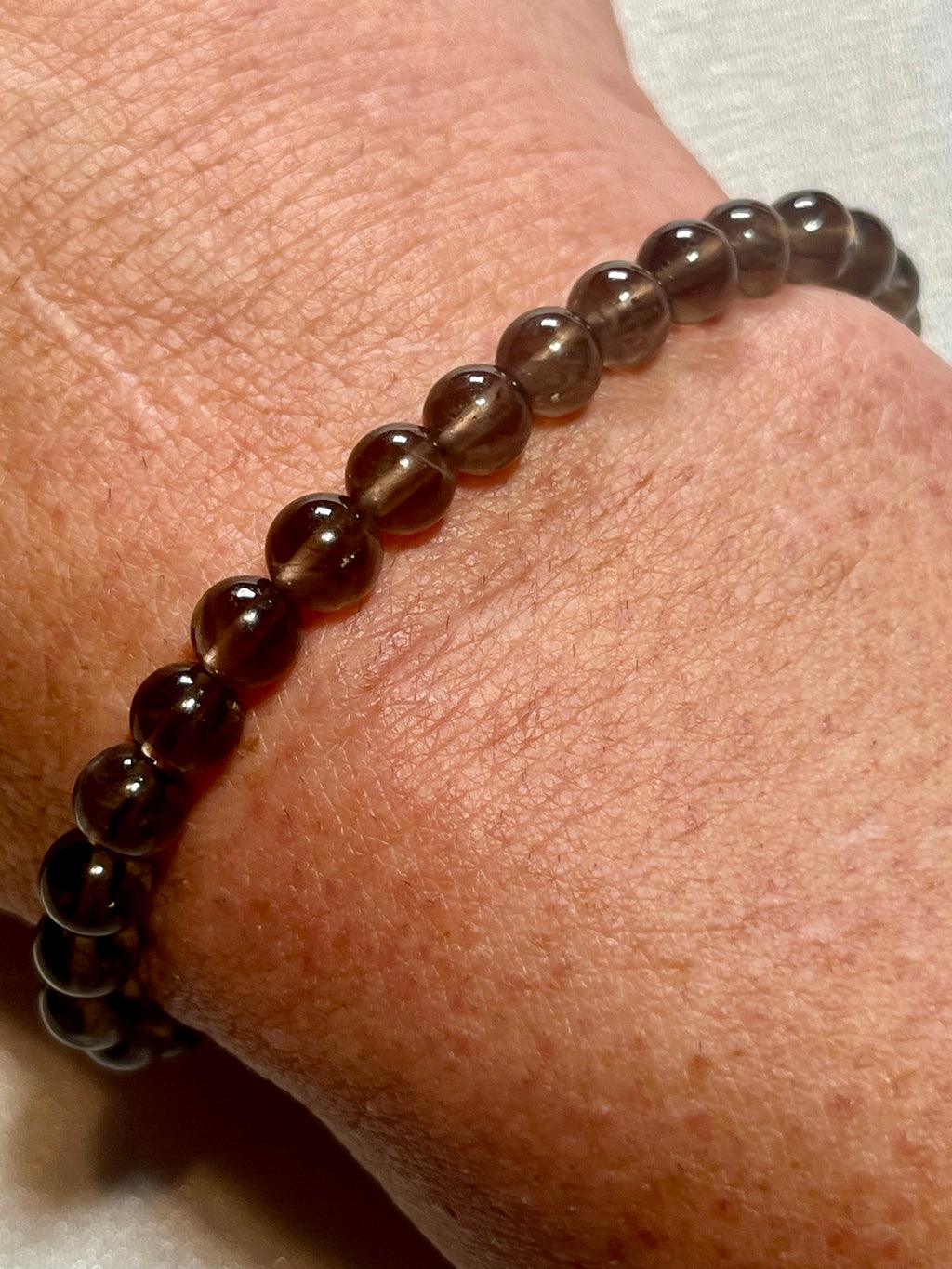 Smoky Quartz smooth round 6mm bead stretch bracelet (AA grade)