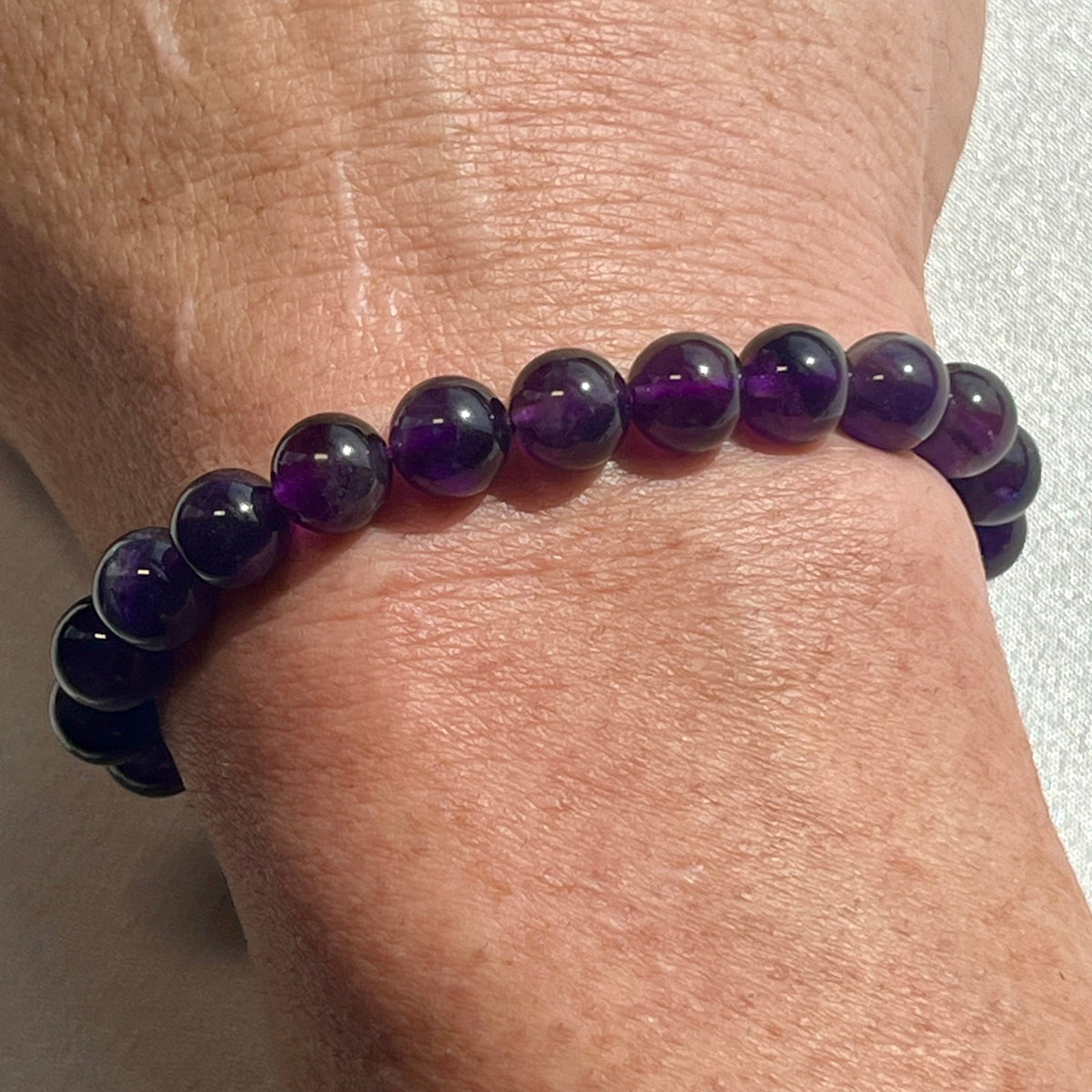 Amethyst (dark) smooth round 6mm, 8mm bead stretch bracelet; February birthstone