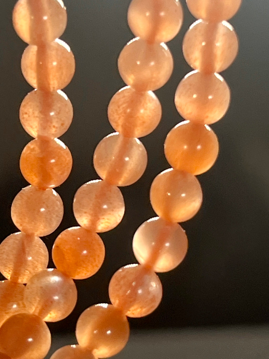 Sunstone w/ strong Moonstone-like adularescence smooth round 4mm bead stretch bracelets (premium grade)