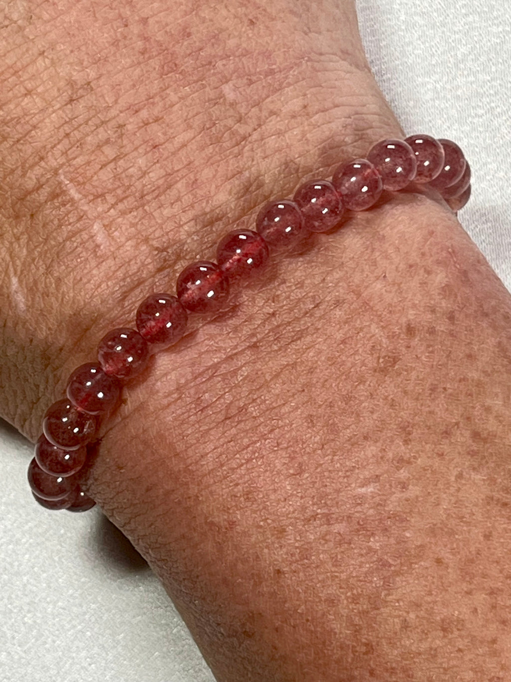 Strawberry Quartz smooth round 6mm bead stretch bracelet (AA grade)