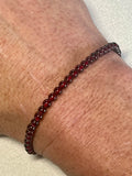Red Garnet smooth round 4mm stretch bracelet (AA grade); January birthstone