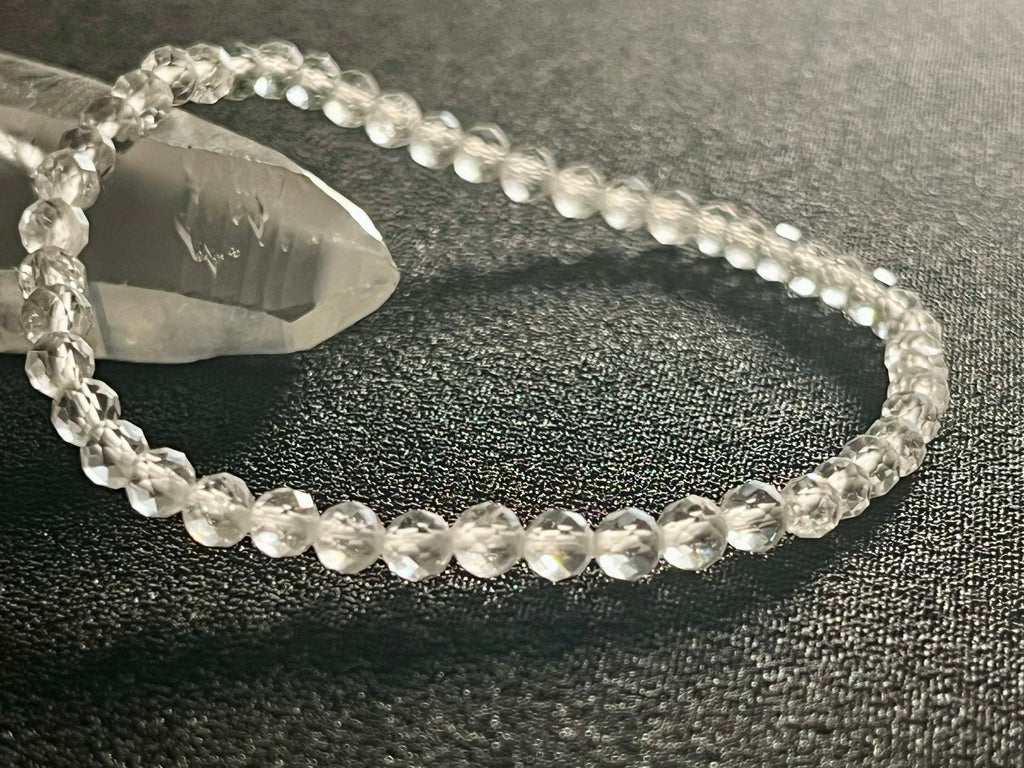 Clear Crystal Quartz faceted round 4mm bead stretch bracelet (premium)