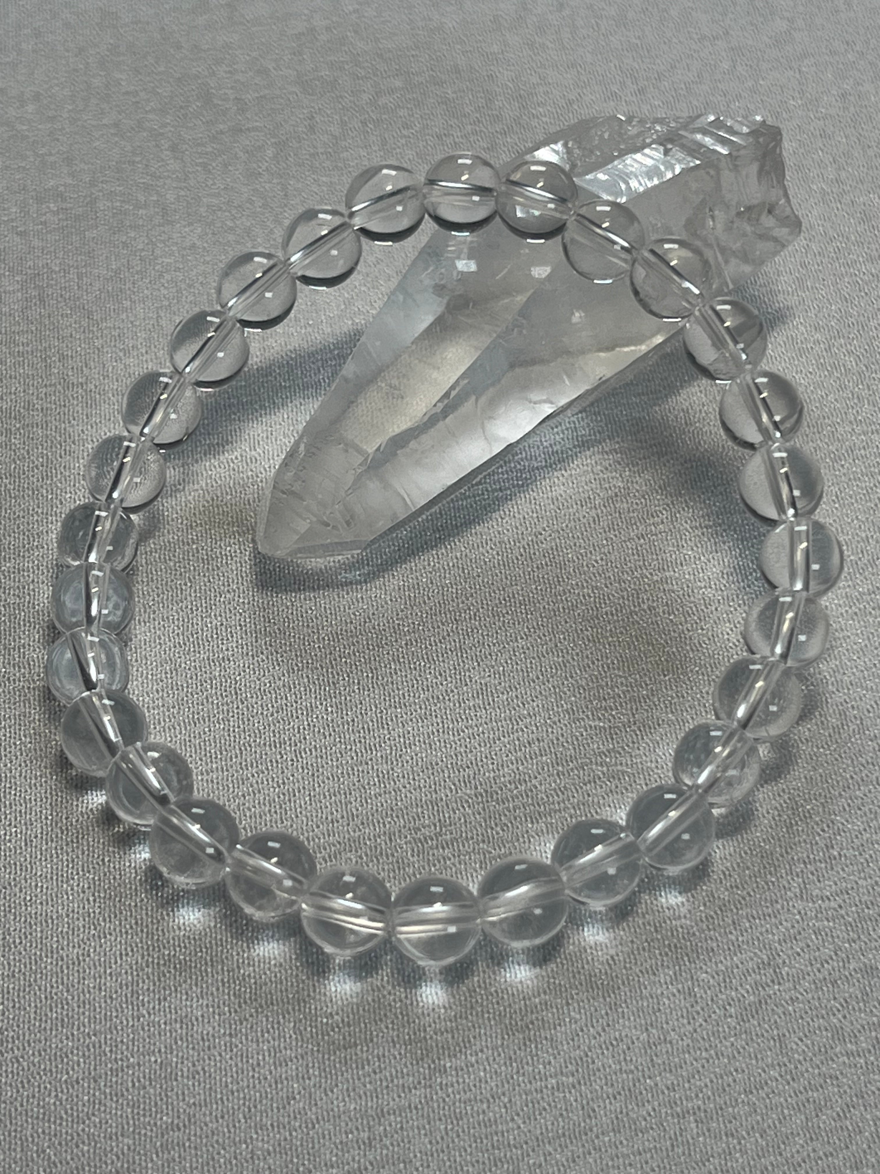 Clear Crystal Quartz smooth round 4mm, 6mm bead stretch bracelet (premium)