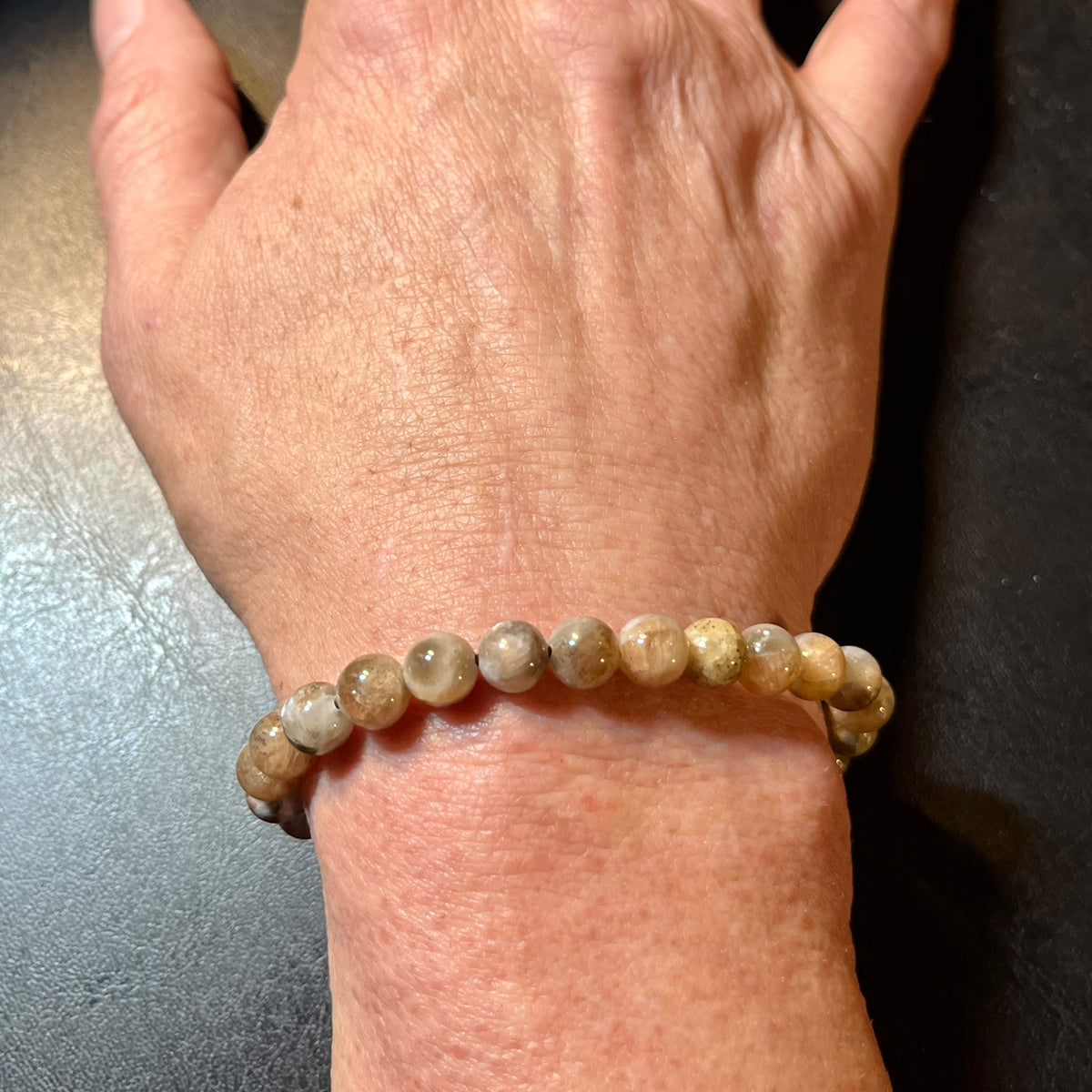 Black Sunstone smooth round 7mm bead stretch bracelet (AA grade)