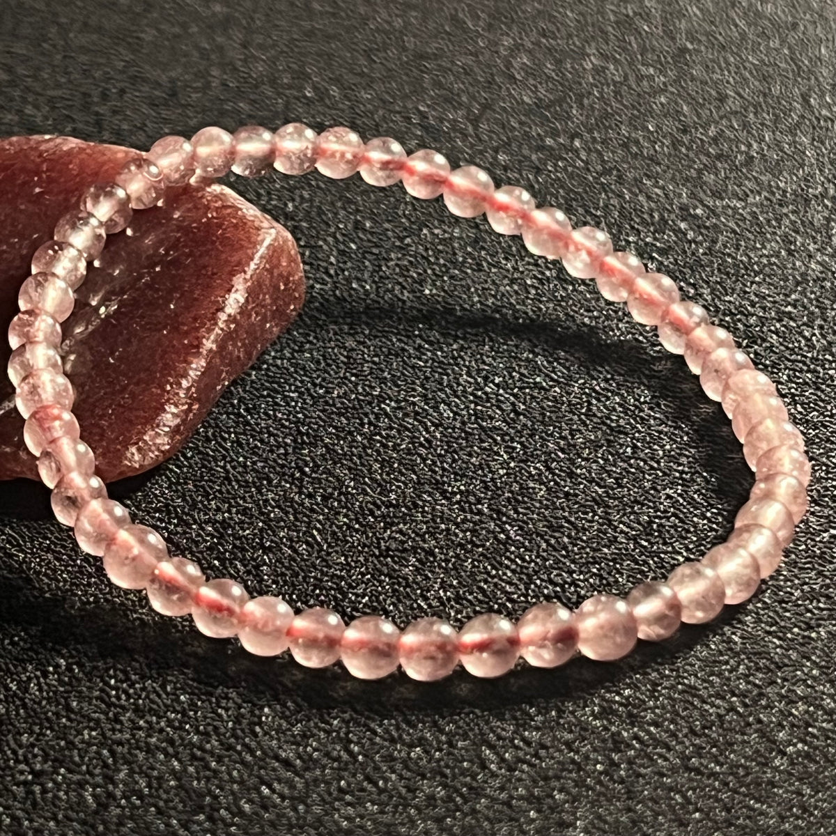 Light Strawberry Quartz smooth round 4mm bead stretch bracelet